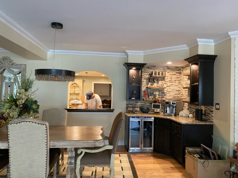 Shows a nicely staged kitchen area, with brand new paint on the walls and ceiling.