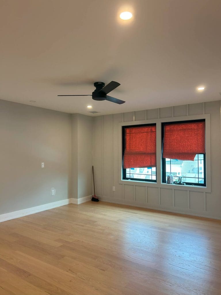 Freshly painted living room with wood floors and modern ceiling fan in ocean county, nj